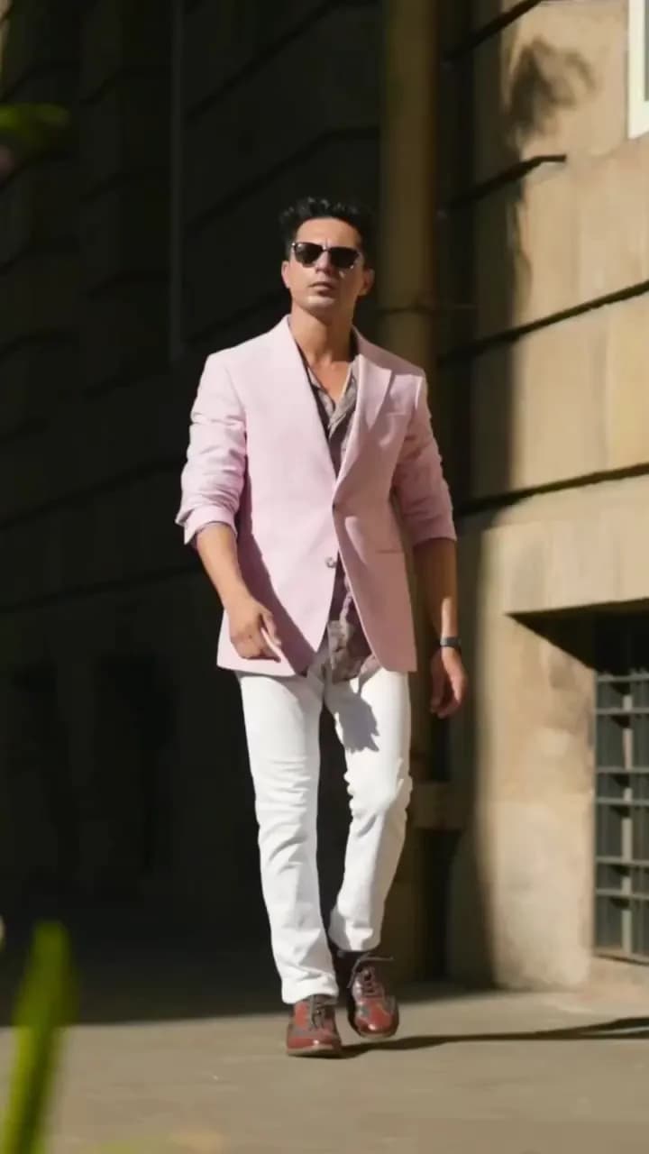 Summer menswear reel: a pink linen blazer and white trousers styled on location