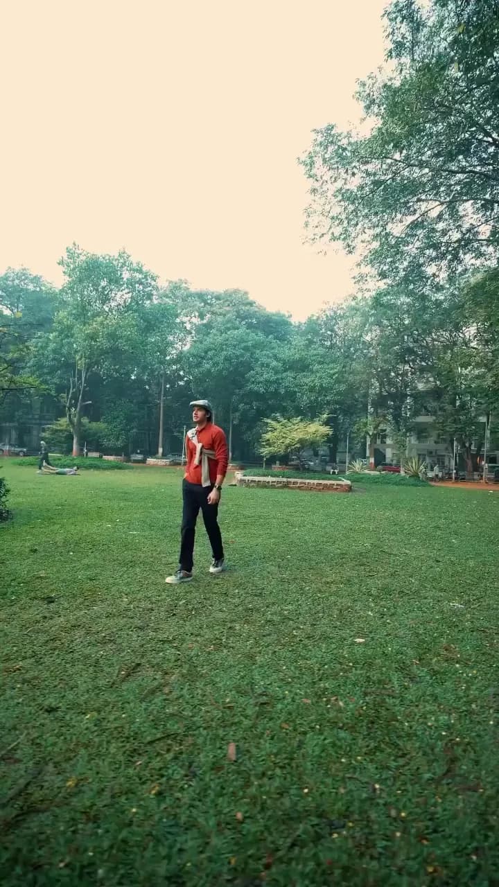Autumn menswear reel: a red knit and flat cap styled for a day in the park